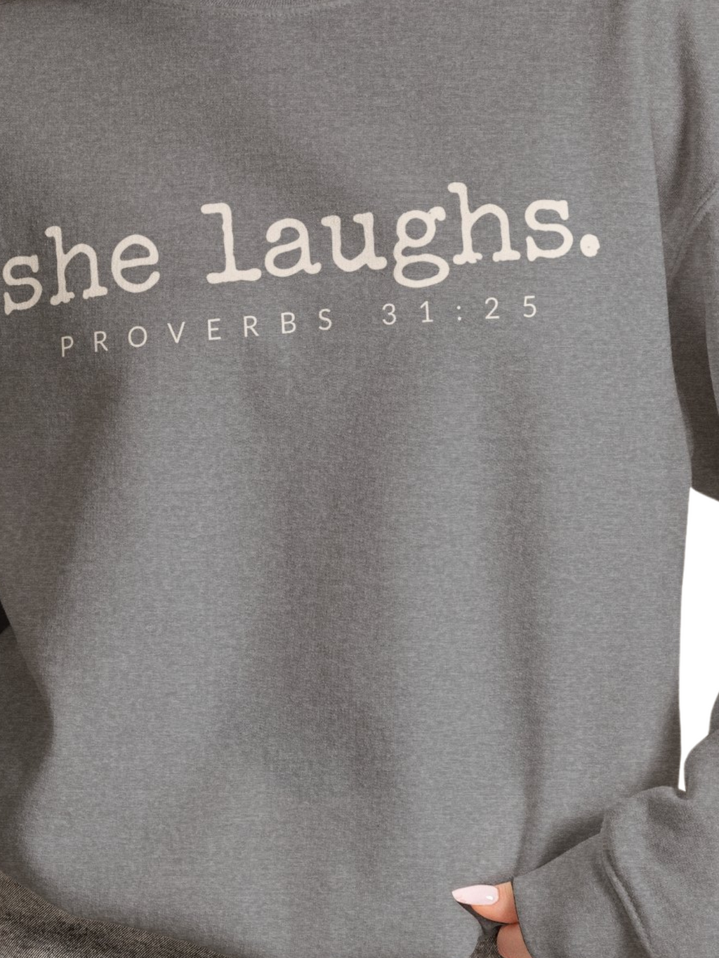 Close-up of ivory She Laughs Proverbs 31:25 lettering on a gray sweatshirt