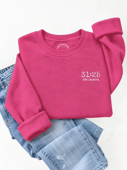 Heliconia pink 31:25 Minimal Sweatshirt styled flat with light-wash denim jeans, showing the small white chest print and ribbed details.