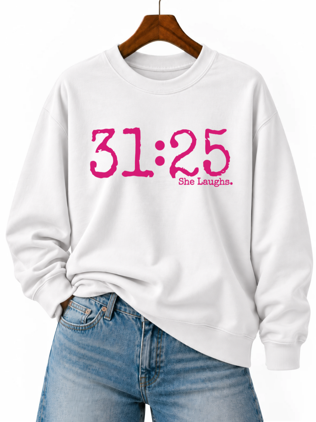 White 31:25 sweatshirt with oversized hot-pink front lettering, displayed on a wooden hanger with blue jeans.